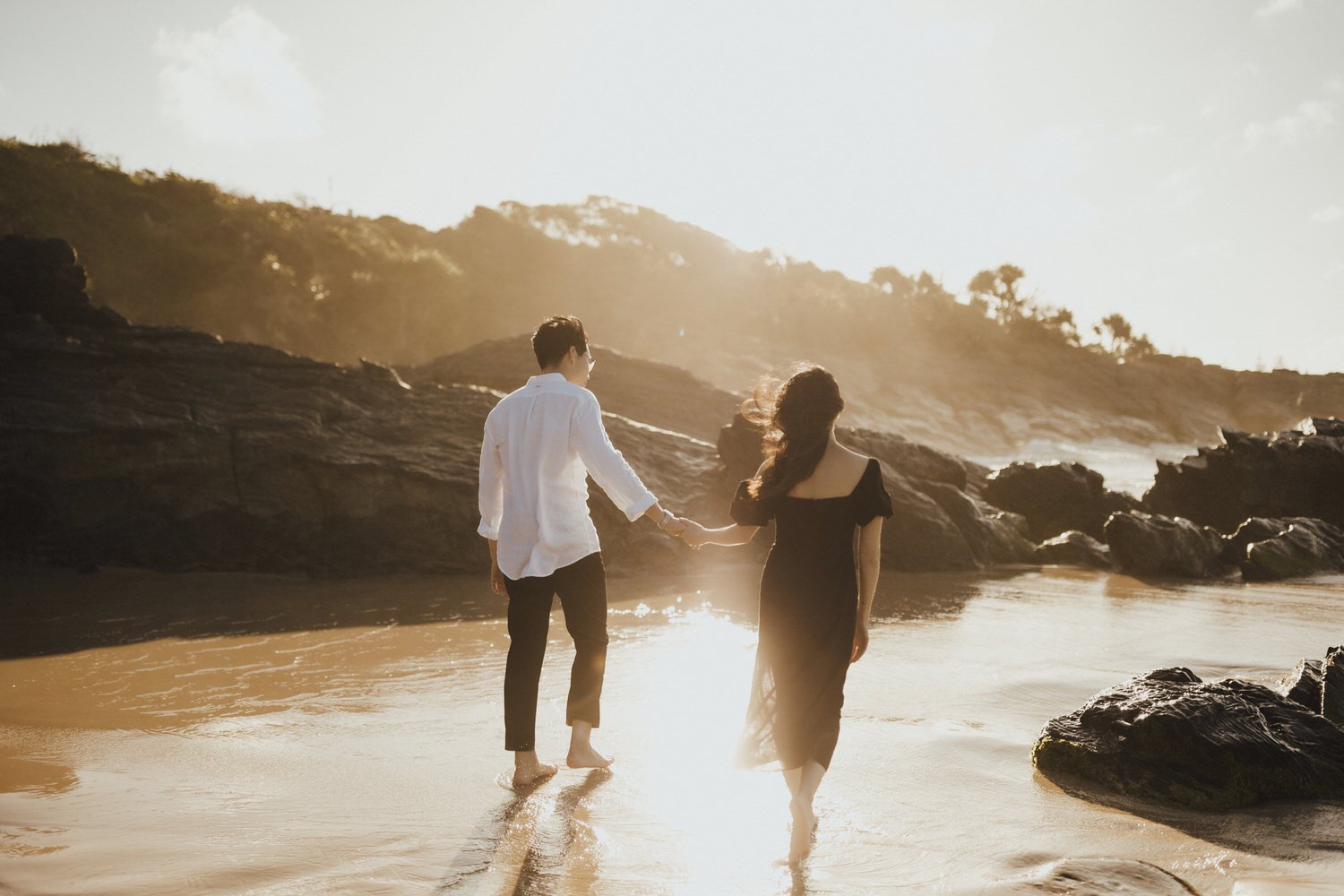 Gold Coast wedding photographer engagement photos at cabarita beach at sunset with coastal backdrop